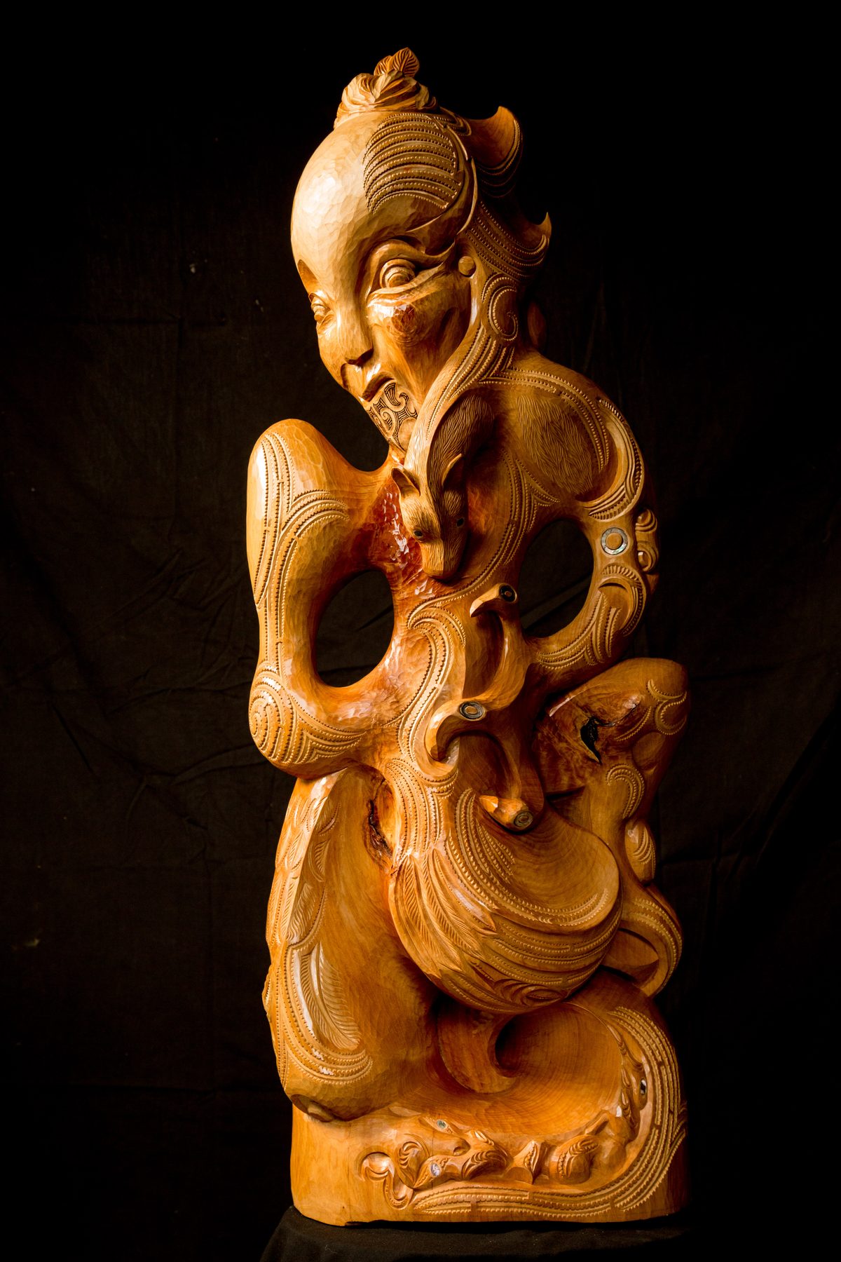 Niwareka: a figure with a topknot, the body worked through with open spaces.