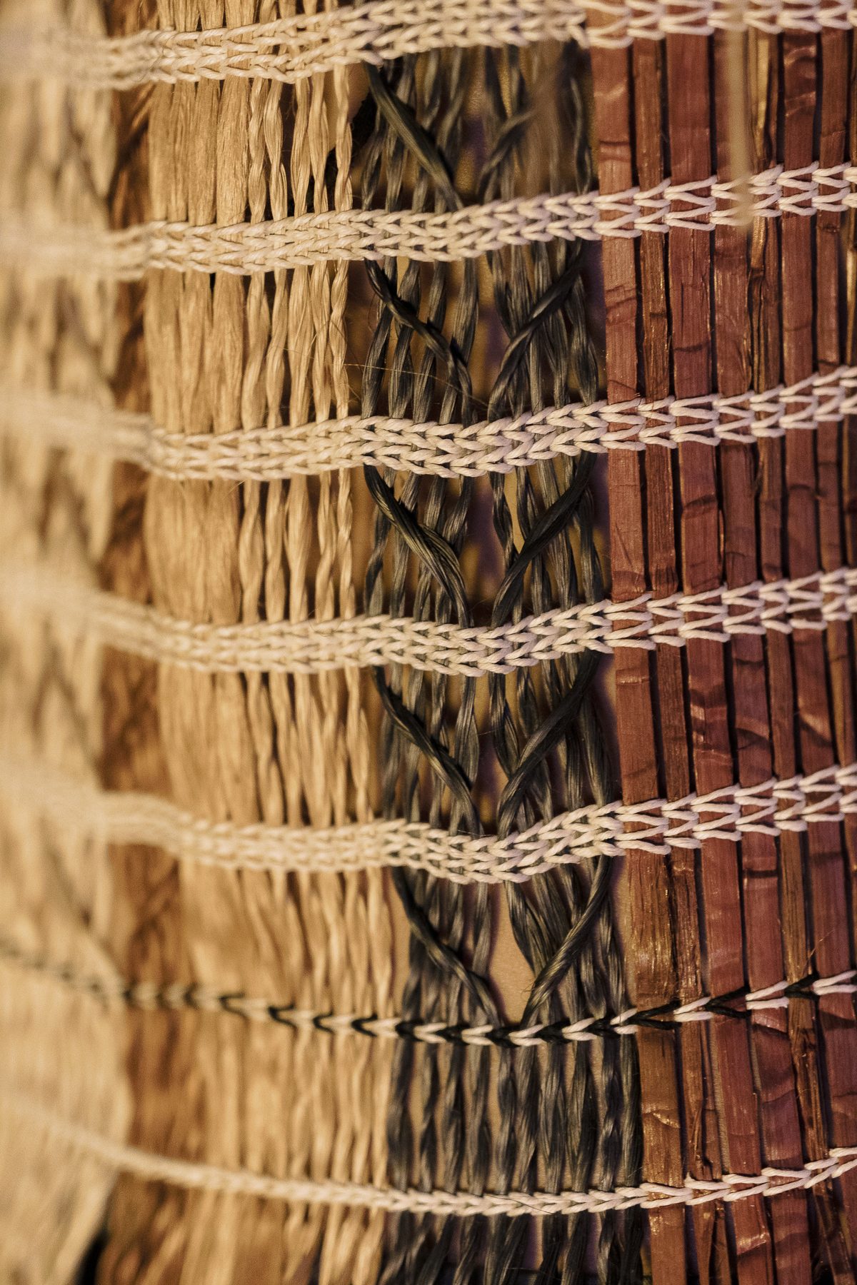 Raranga by Ruth Woodbury: the bodice weave close, bands of colour bound across.
