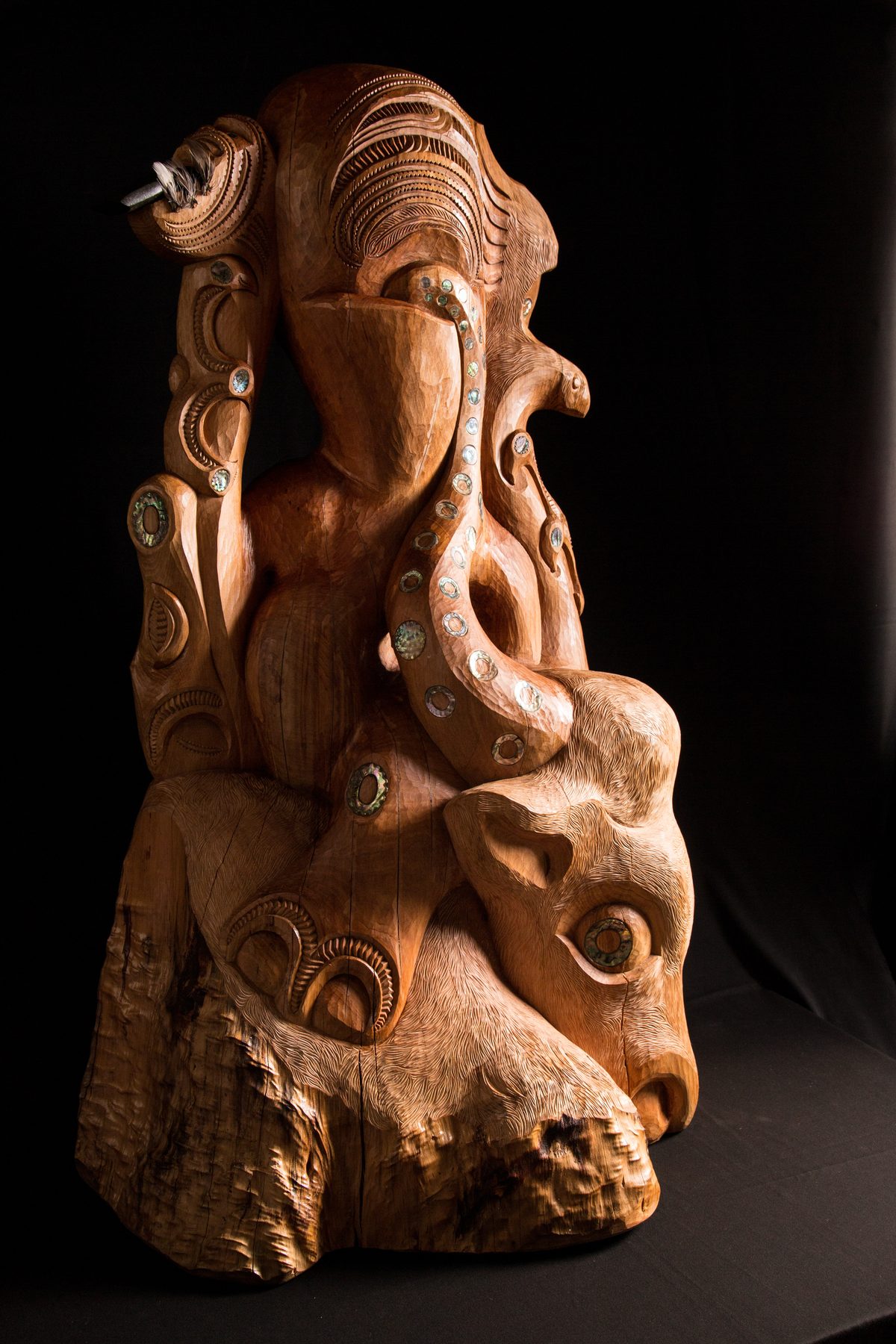 Te Ara Whakaiti, from the other side: the hand with the toki, the bull's pāua eye at the base.