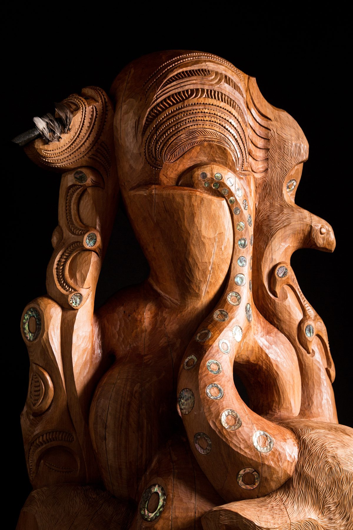 Te Ara Whakaiti: the toki held high, the masked face, the tentacle running down.